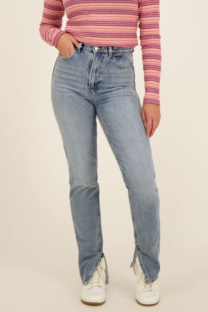 light blue jeans with slit