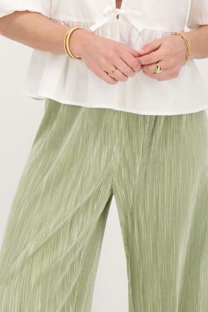 Light green pleated pants with elastic waistband