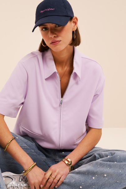 Polo zipp&eacute; lilas &agrave; manches courtes