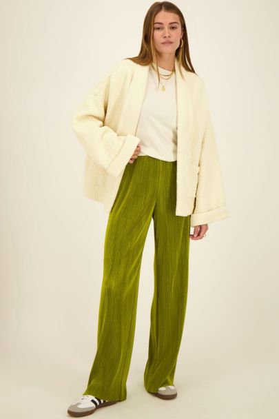 Green pleated trousers