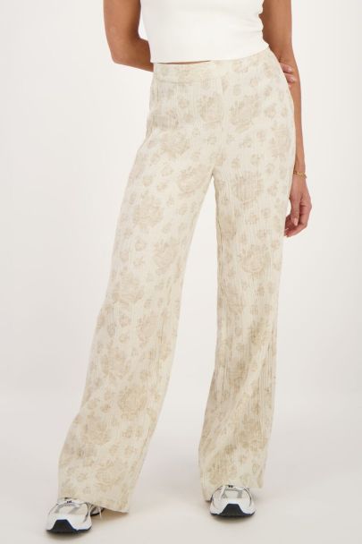 Pantalon beige avec imprimé fleuri jacquard