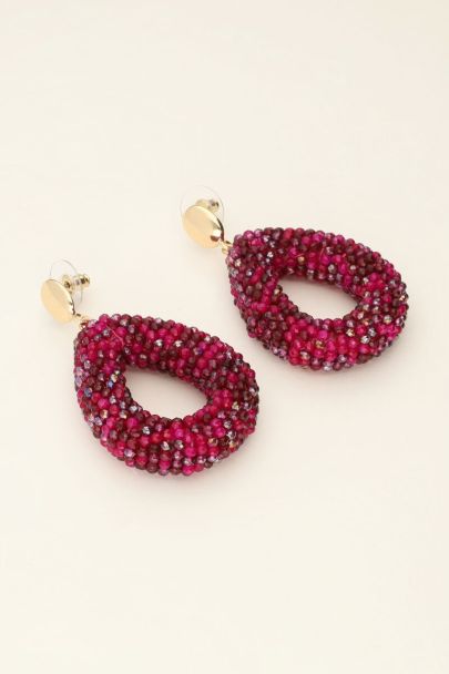 Statement oorbellen met roze drop