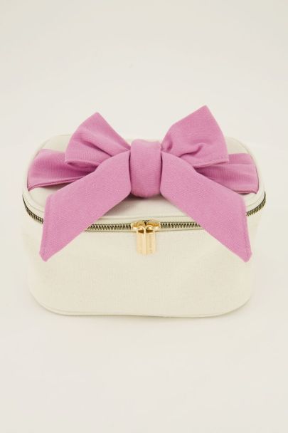 Beige toiletry bag with pink bow