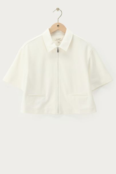 Polo zippé blanc à manches courtes 