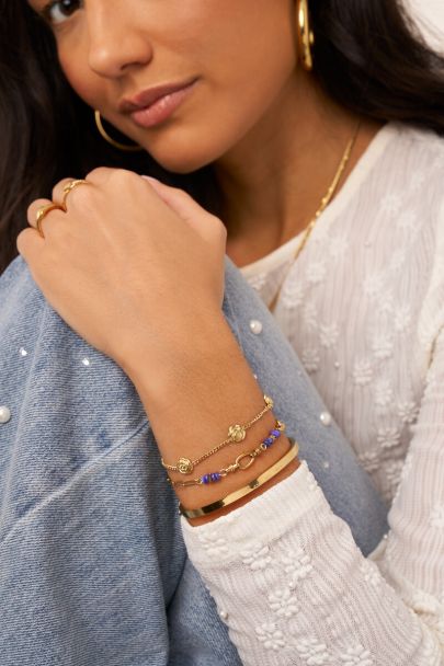 Ovale schakelarmband met blauwe kralen