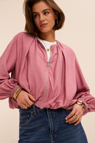 Roze top in ballon look met rits