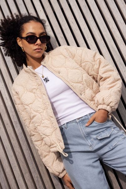 Beige padded bomber jacket with texture