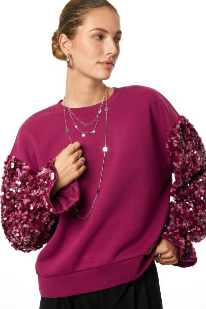 Paarse sweater met pailletten mouwen