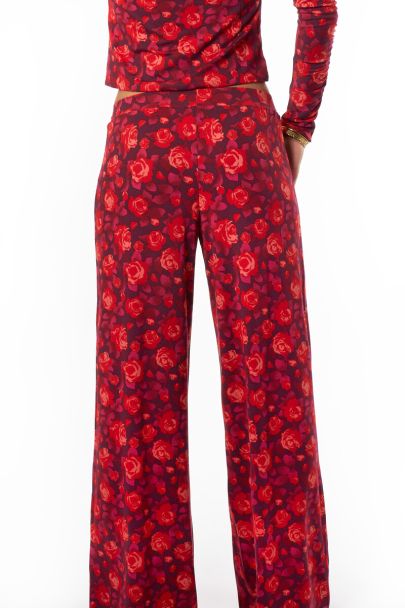 Pantalon large violet avec imprimé rose