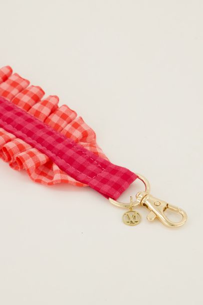 Pink phone cord with plaid