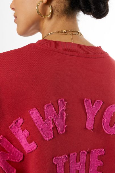 Red sweater "City of dreams"