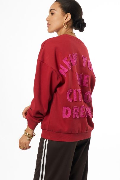 Red sweater "City of dreams"