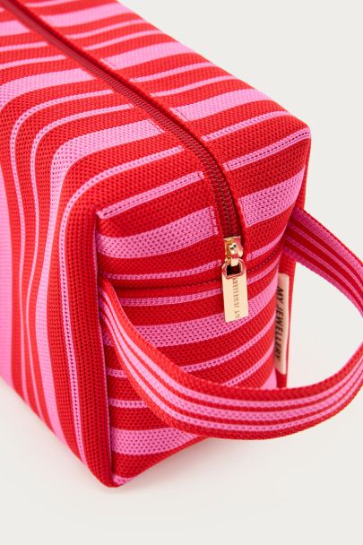 Red toiletry bag with pink stripes