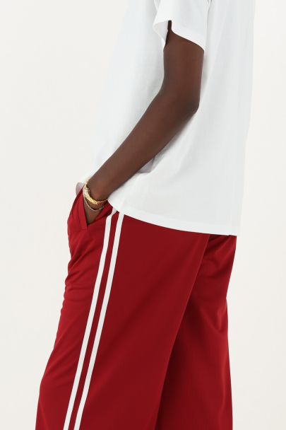 Rote weite Jogginghose mit Streifen