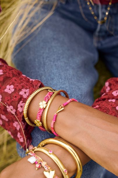 Roze gevlochten armband met klaver
