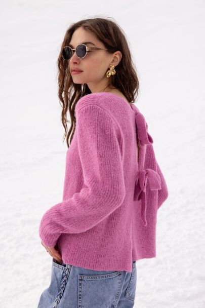 Roze gebreide trui met strikken