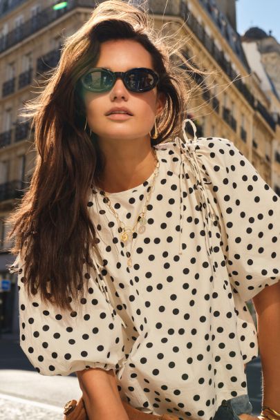 Black and white polka dot balloon top with bows and puff sleeves