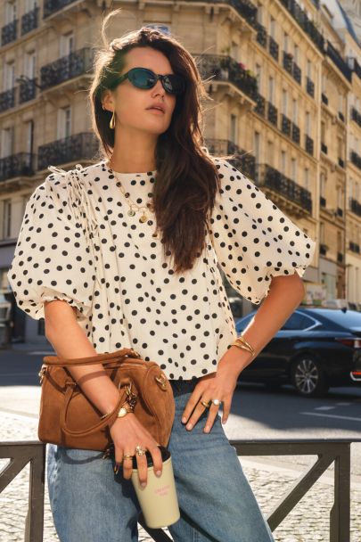 Black and white polka dot balloon top with bows and puff sleeves