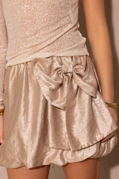 Goudkleurige rok met grote strik
