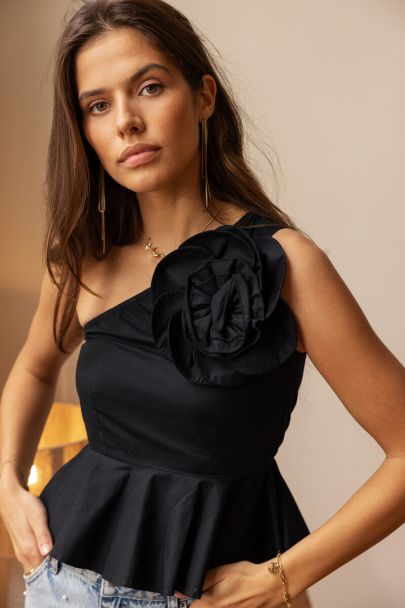 Black one-shoulder top with large flower