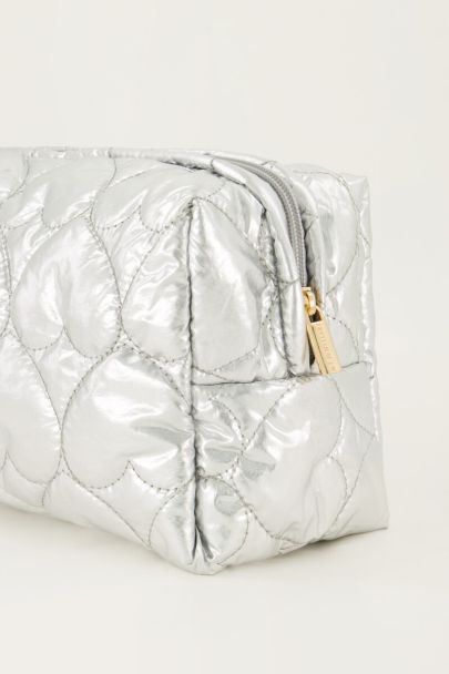 Silver coloured toiletry bag with padded hearts