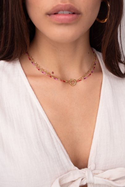 Triple necklace with red and pink beads