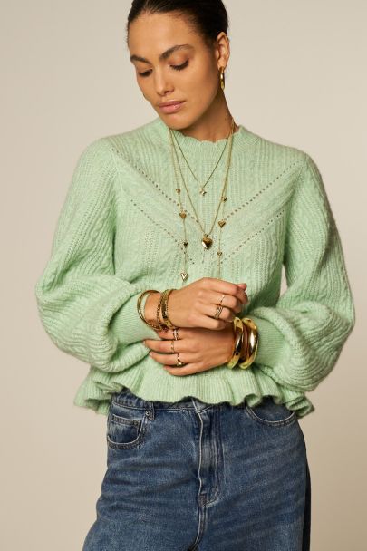Pull turquoise à torsades avec bord festonné