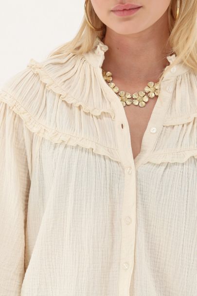 White muslin blouse with ruffles