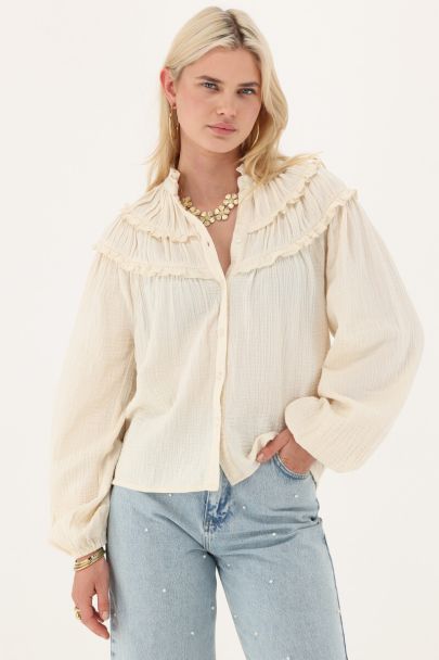 White muslin blouse with ruffles