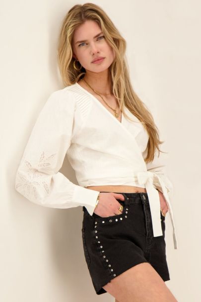 White pleated blouse with embroidered sleeves