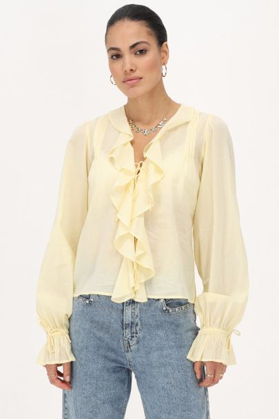 Gele blouse met ruffles & strikjes