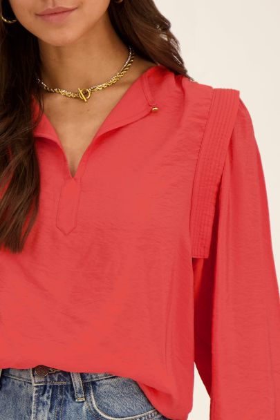 Red blouse with shoulder details