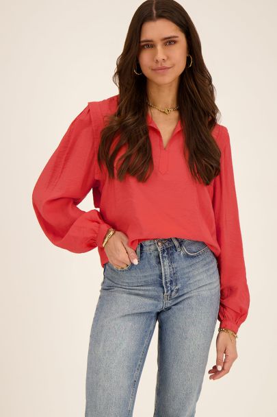 Red blouse with shoulder details