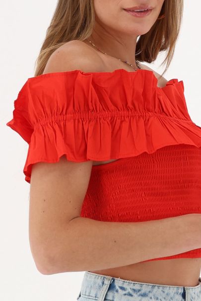 Top rouge à smocks et volants