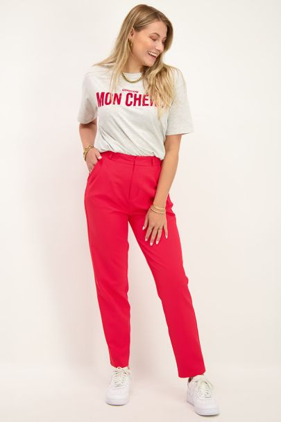 Red trousers with press crease