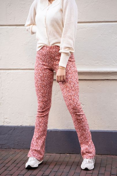 Pink floral print flared trousers