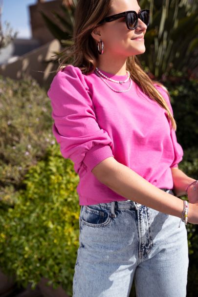 Pink sweater with 3/4 length puff sleeves