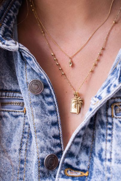 Souvenir ketting met spiraal schelp bedel