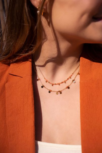 Vintage ketting met oranje kralen & muntjes