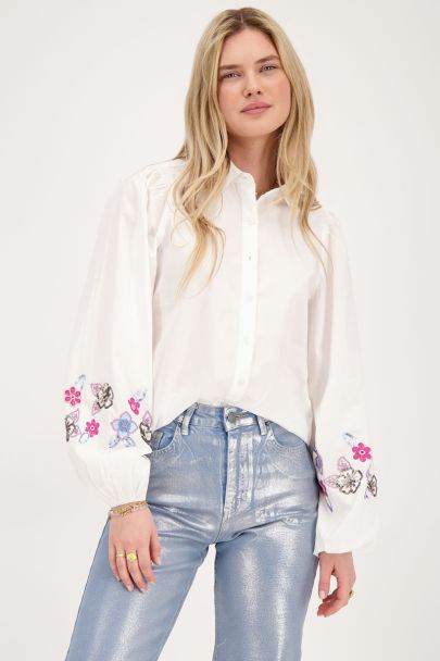 White blouse with blue beaded flowers