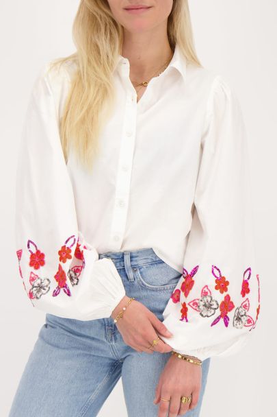 White blouse with pink beaded flowers