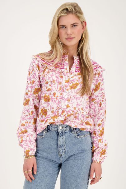 White blouse with pink floral print and embroidery