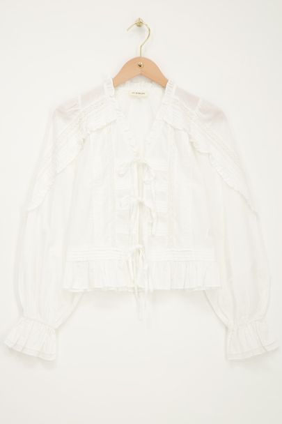 Blouse blanche avec nœuds