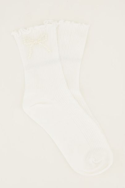 Witte sokken met parel strikje