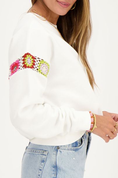 White sweatshirt with multicoloured crochet