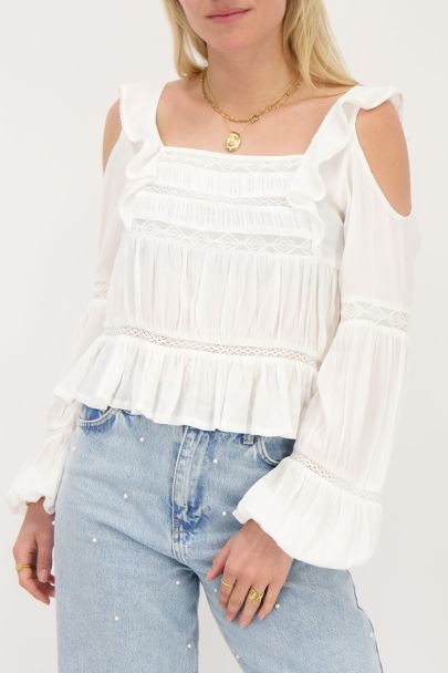 White top with long sleeves and ruffles
