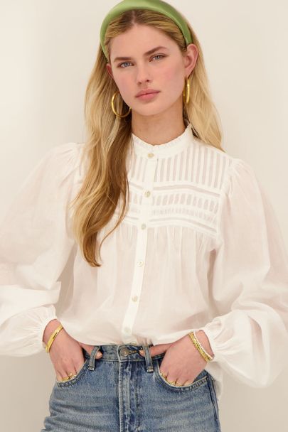 White pleated blouse with puff sleeves