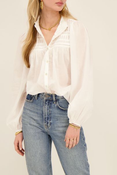 White pleated blouse with puff sleeves