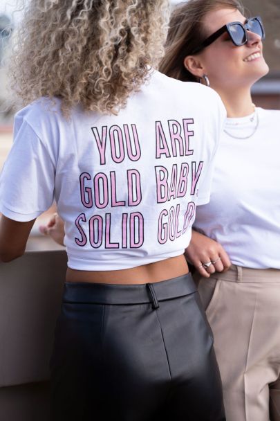 White T-shirt with pink lettering