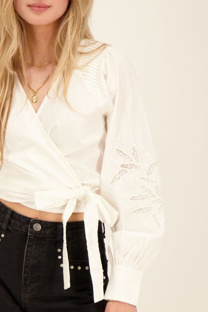 White pleated blouse with embroidered sleeves